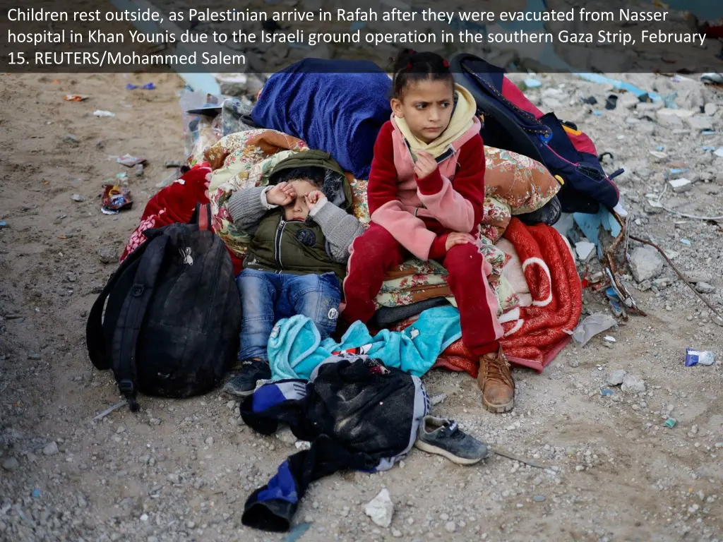 children rest outside as palestinian arrive