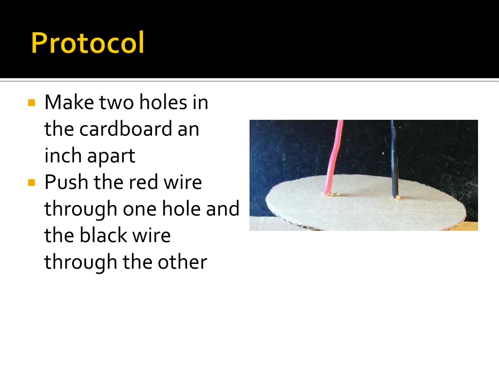 make two holes in the cardboard an inch apart