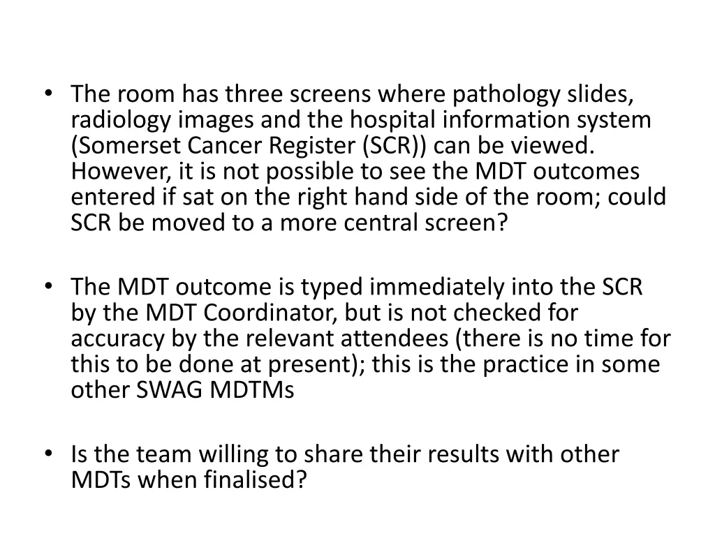 the room has three screens where pathology slides