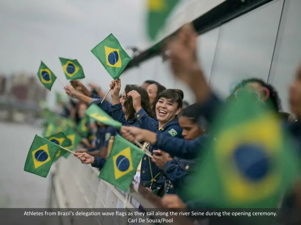 athletes from brazil s delegation wave flags