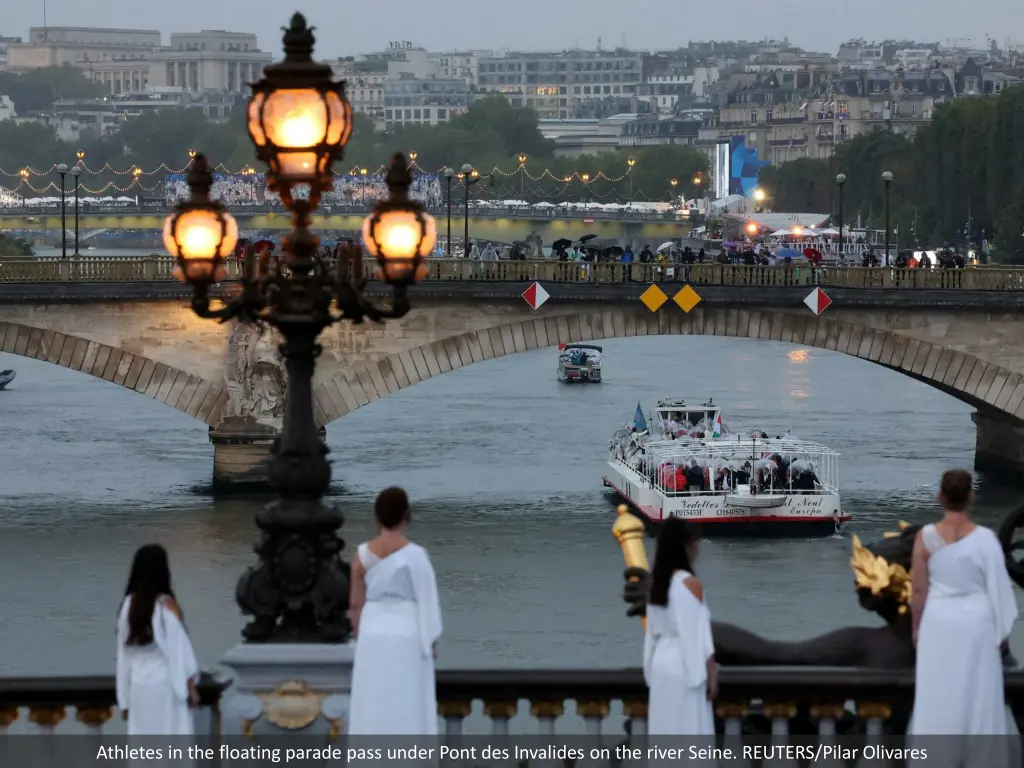 athletes in the floating parade pass under pont