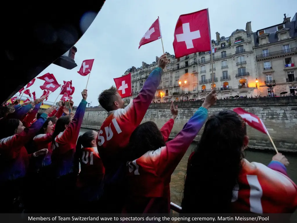 members of team switzerland wave to spectators