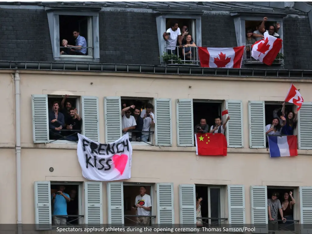 spectators applaud athletes during the opening