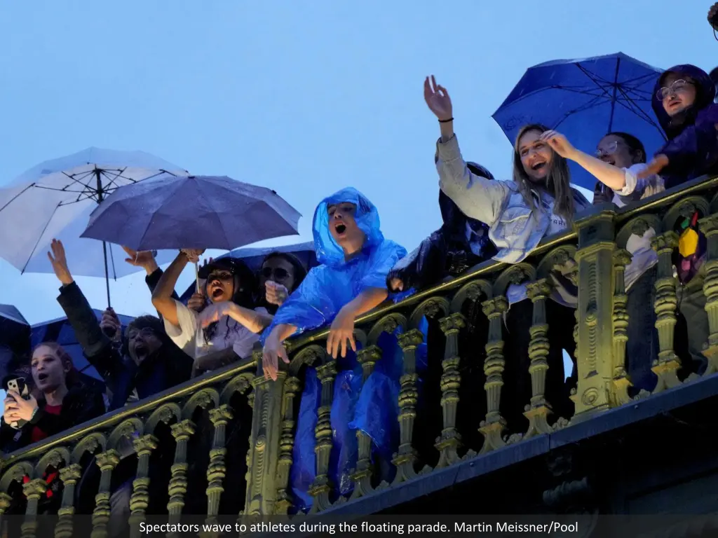 spectators wave to athletes during the floating