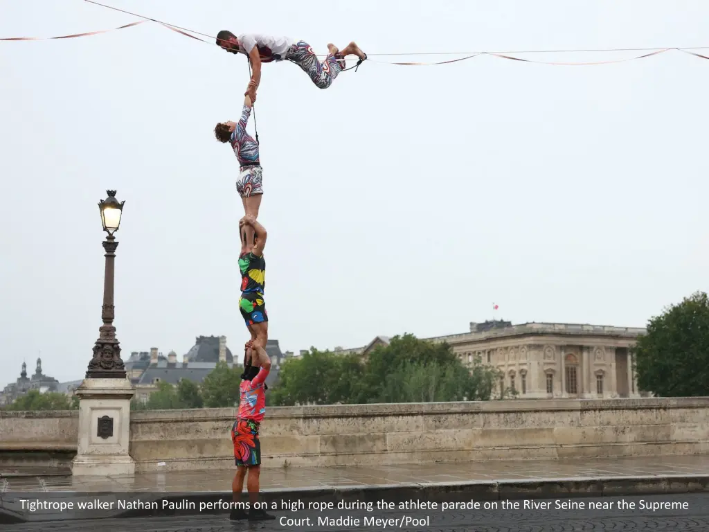 tightrope walker nathan paulin performs on a high