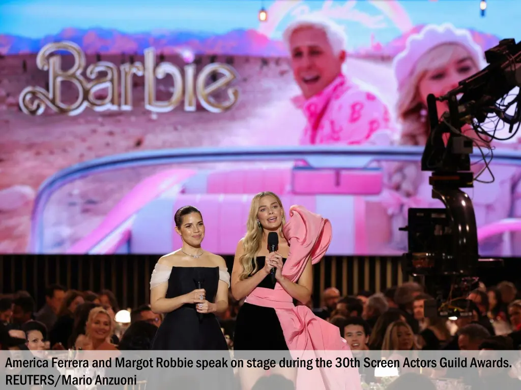 america ferrera and margot robbie speak on stage