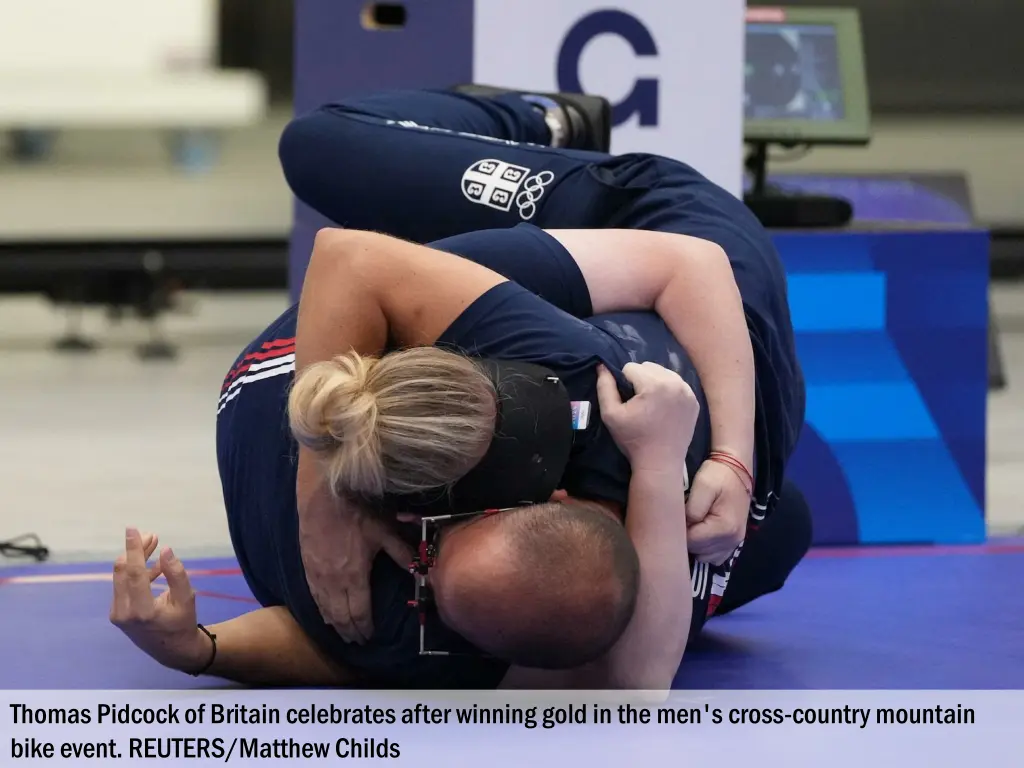 thomas pidcock of britain celebrates after