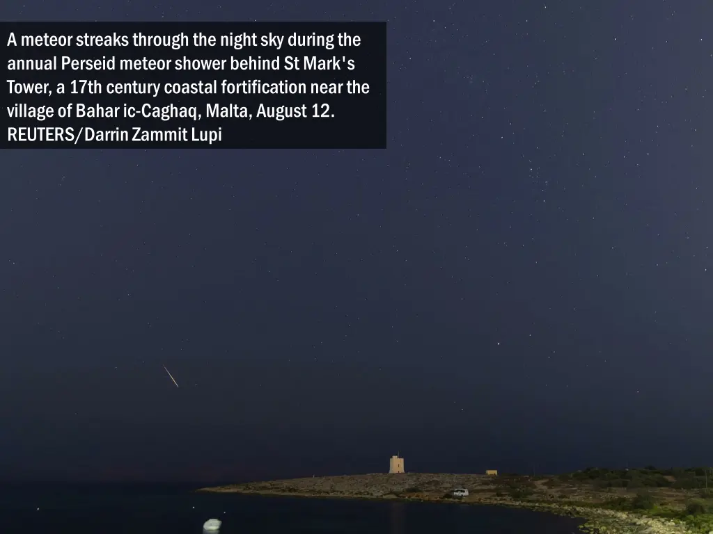 a meteor streaks through the night sky during 1