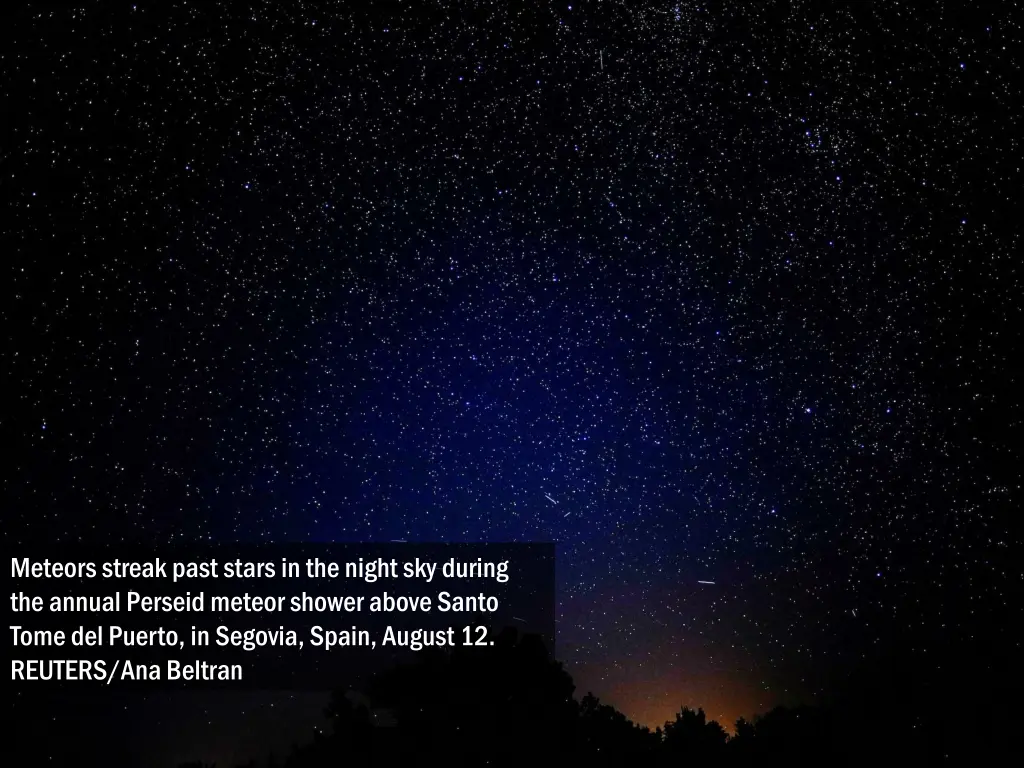 meteors streak past stars in the night sky during 1