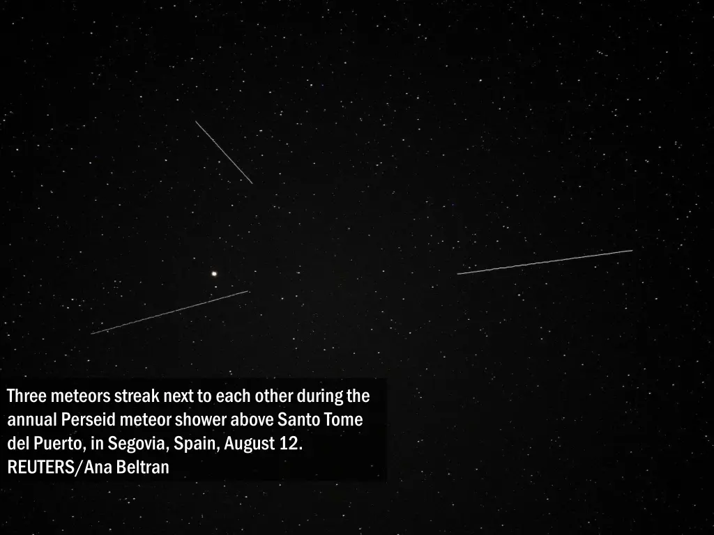 three meteors streak next to each other during