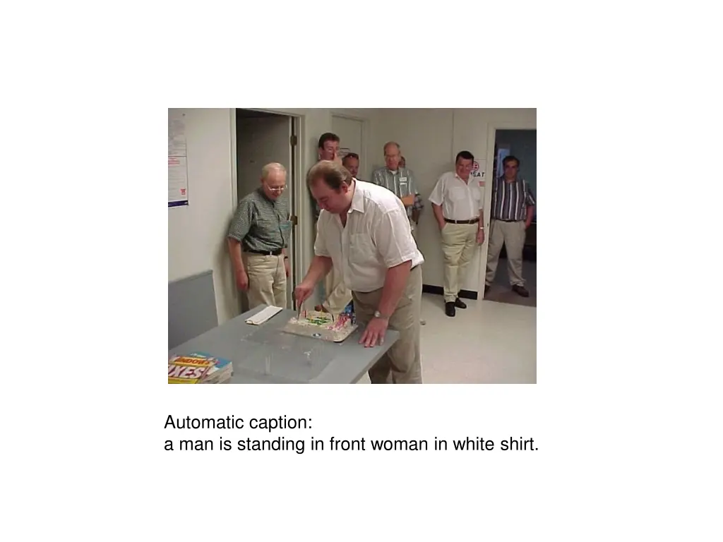 automatic caption a man is standing in front