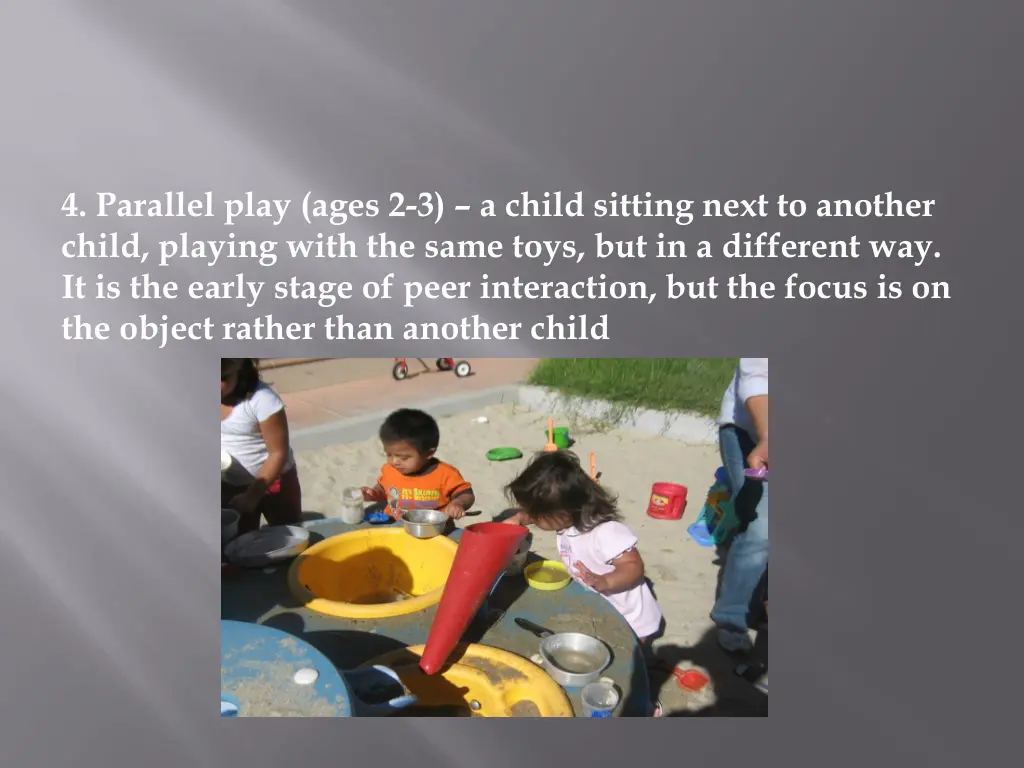 4 parallel play ages 2 3 a child sitting next