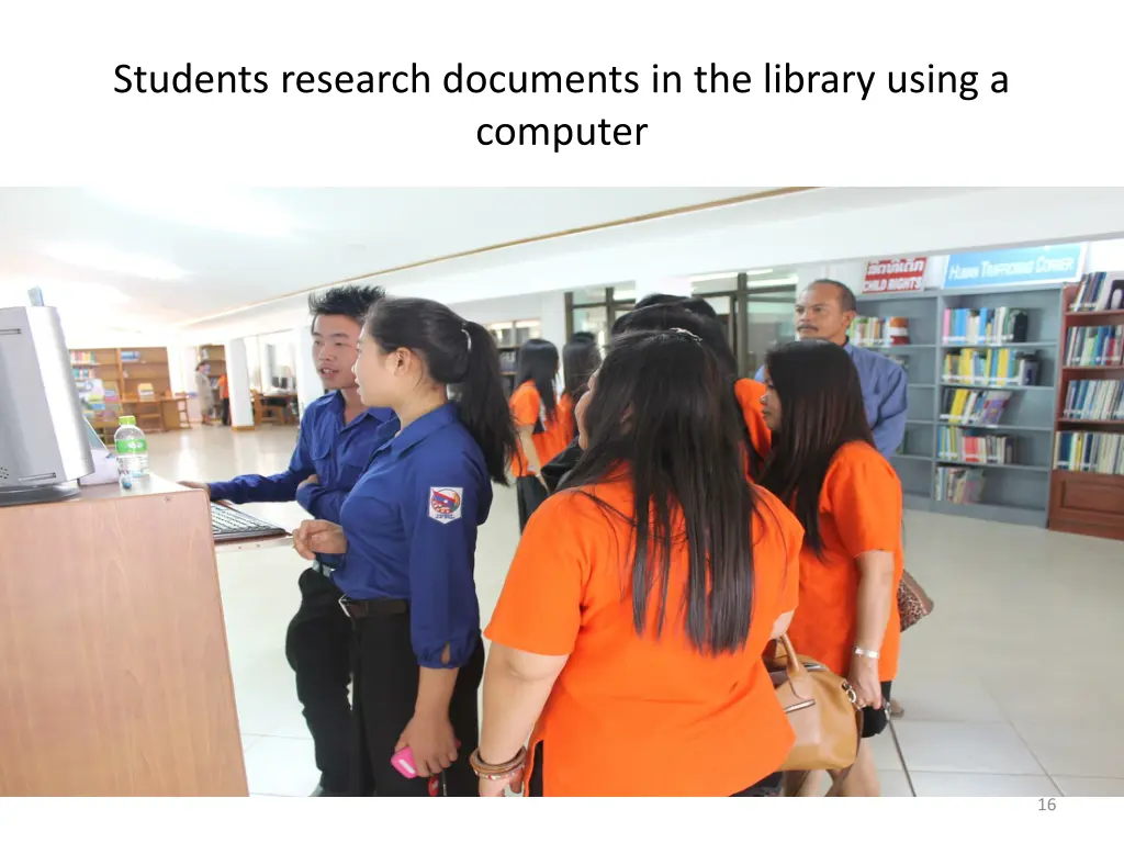 students research documents in the library using