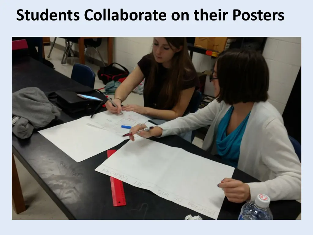 students collaborate on their posters