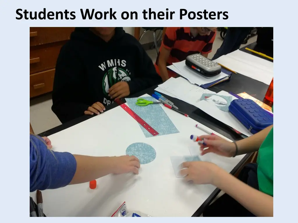 students work on their posters