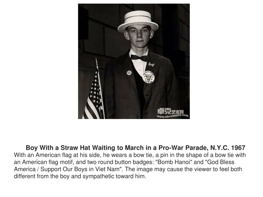 boy with a straw hat waiting to march