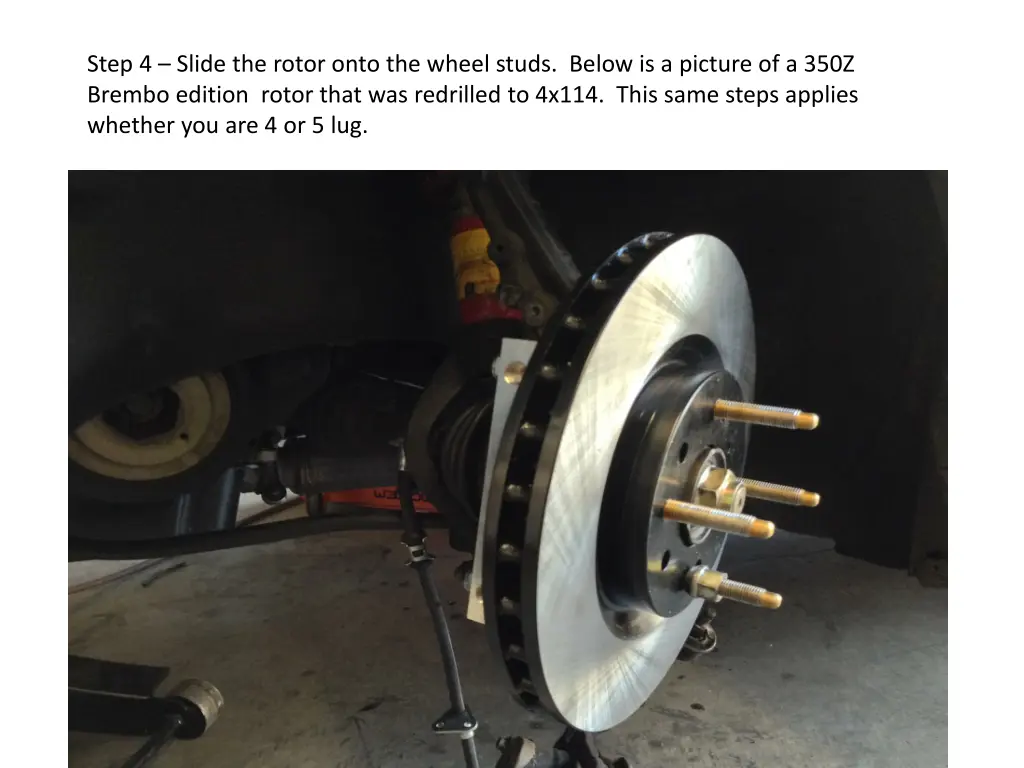 step 4 slide the rotor onto the wheel studs below