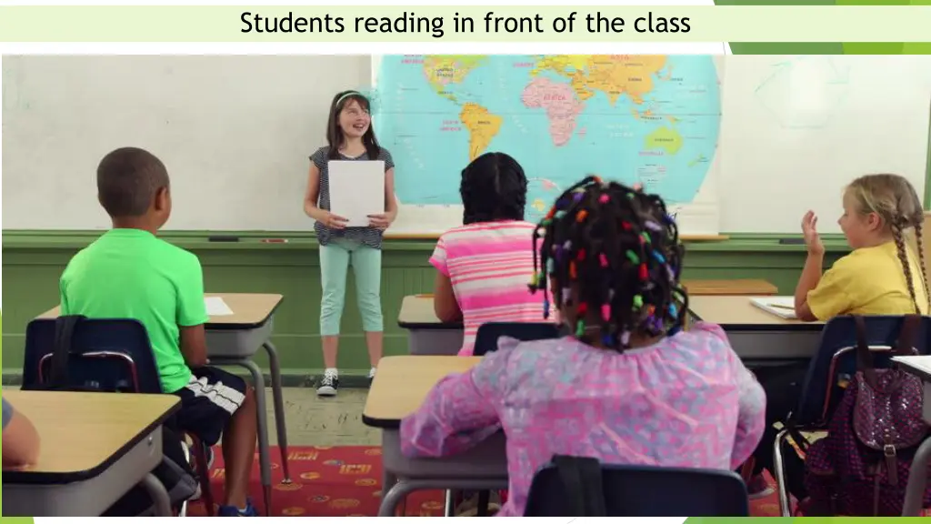 students reading in front of the class