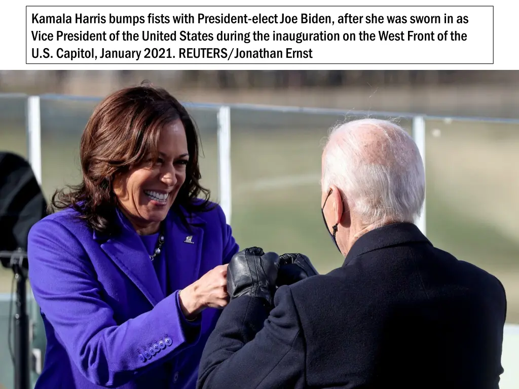 kamala harris bumps fists with president elect