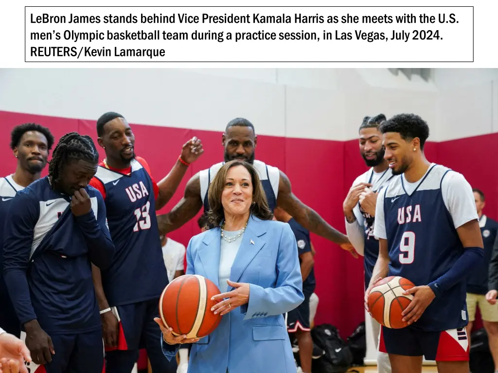 lebron james stands behind vice president kamala