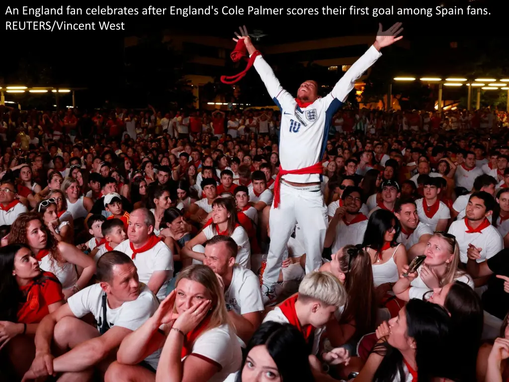 an england fan celebrates after england s cole