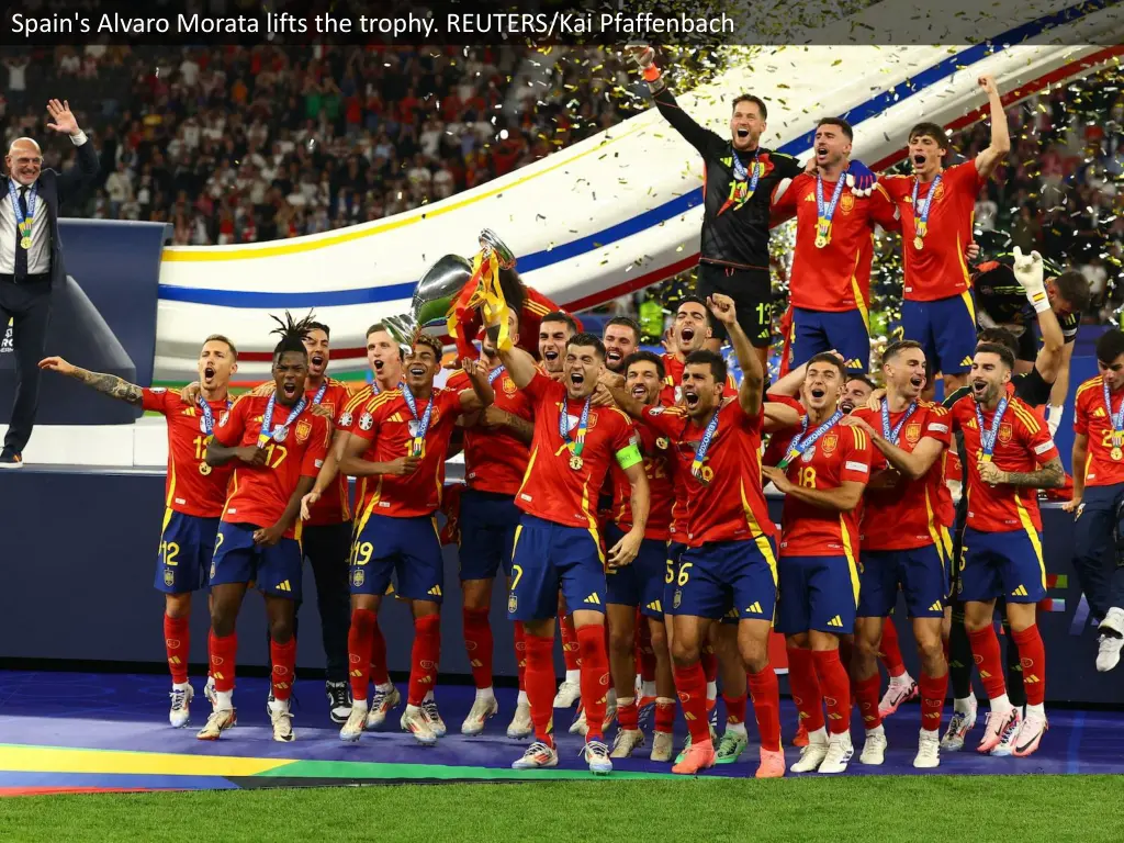 spain s alvaro morata lifts the trophy reuters