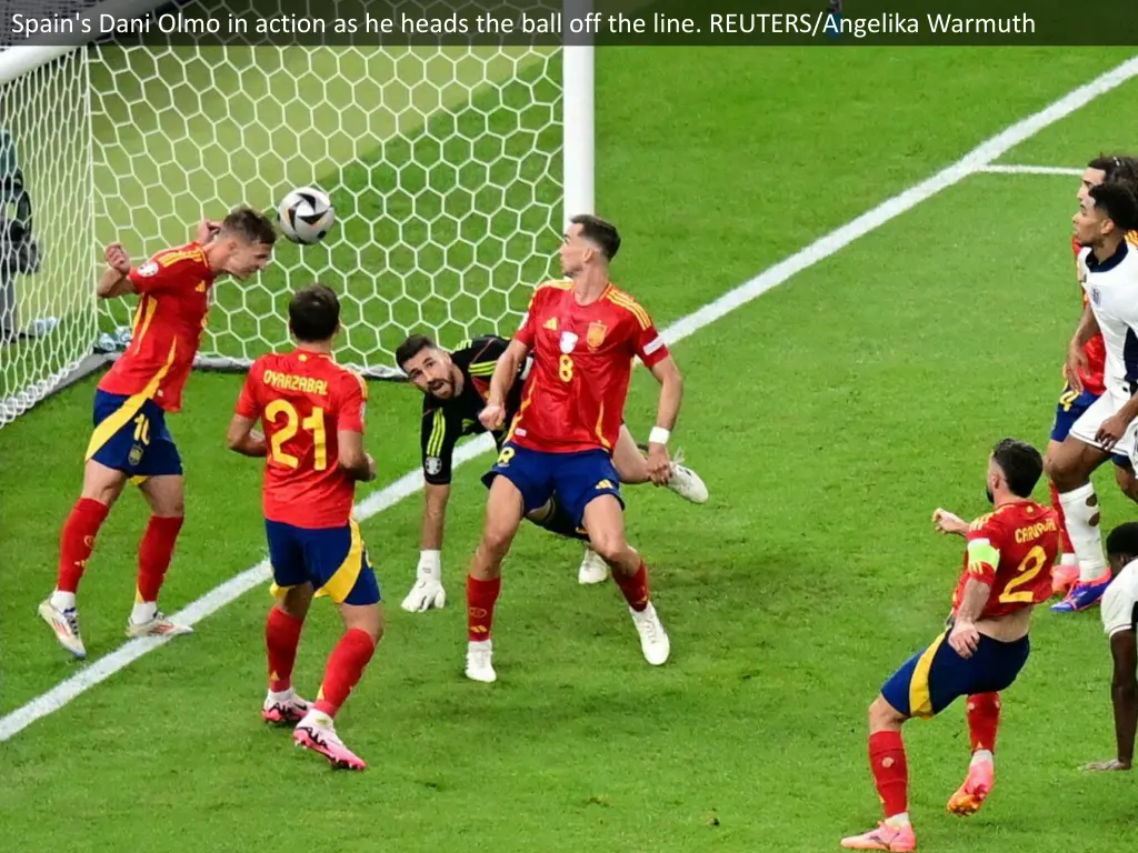 spain s dani olmo in action as he heads the ball