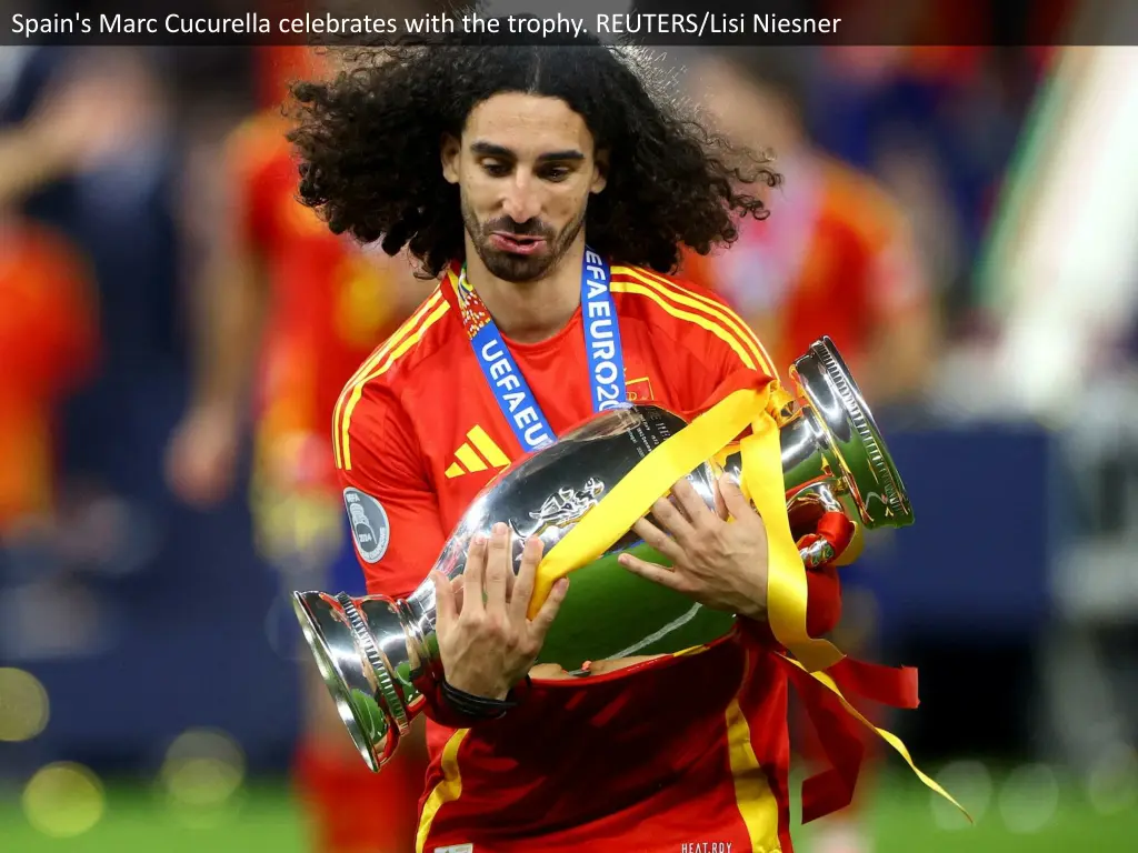 spain s marc cucurella celebrates with the trophy