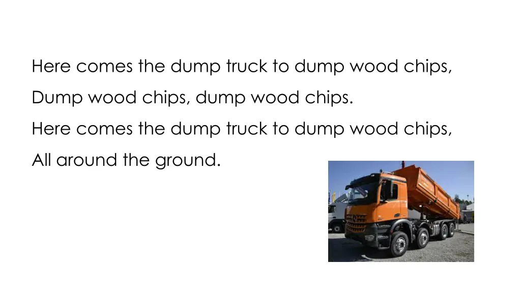 here comes the dump truck to dump wood chips