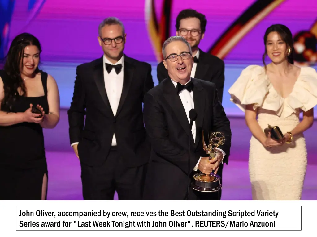 john oliver accompanied by crew receives the best