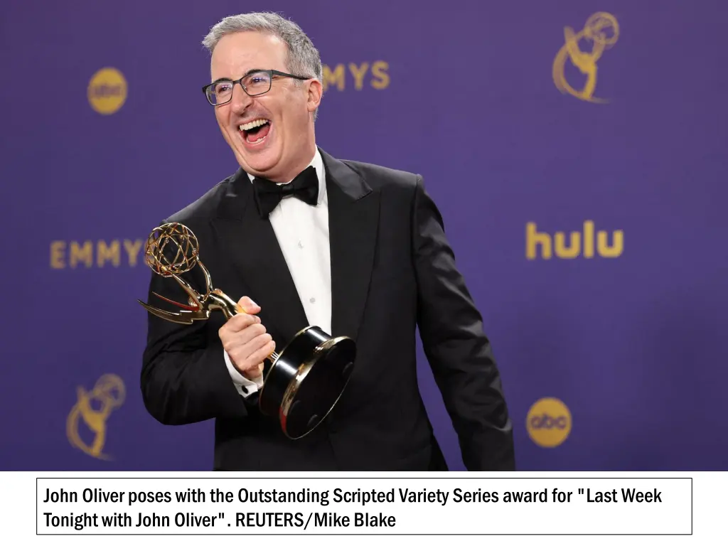 john oliver poses with the outstanding scripted