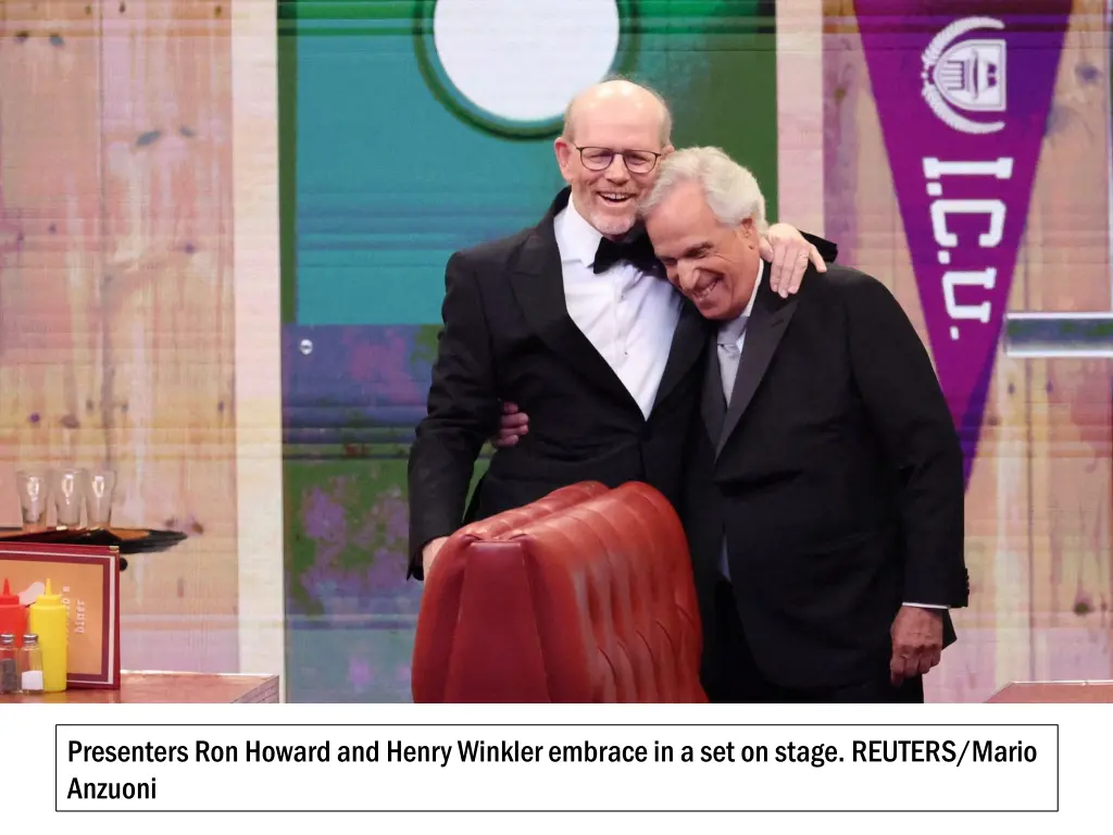 presenters ron howard and henry winkler embrace