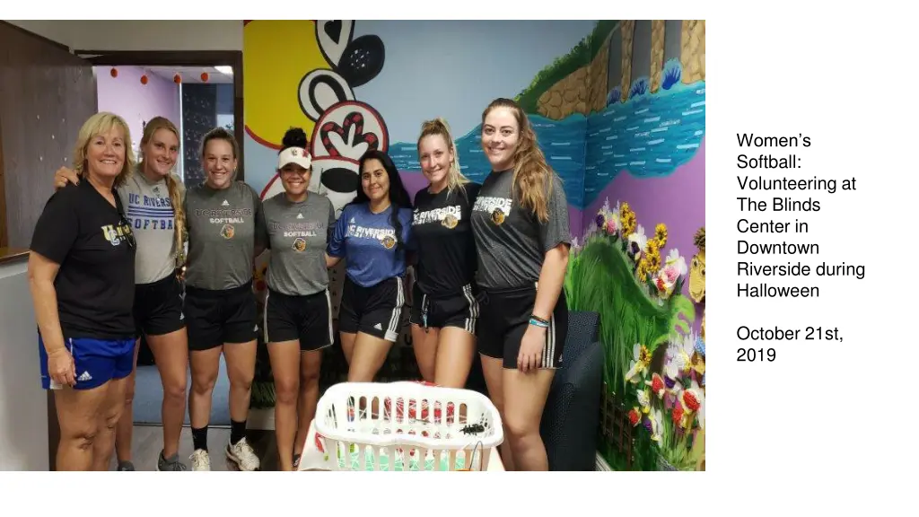 women s softball volunteering at the blinds