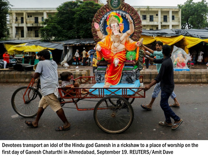 devotees transport an idol of the hindu