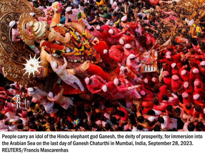 people carry an idol of the hindu elephant