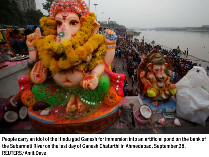 people carry an idol of the hindu god ganesh 3
