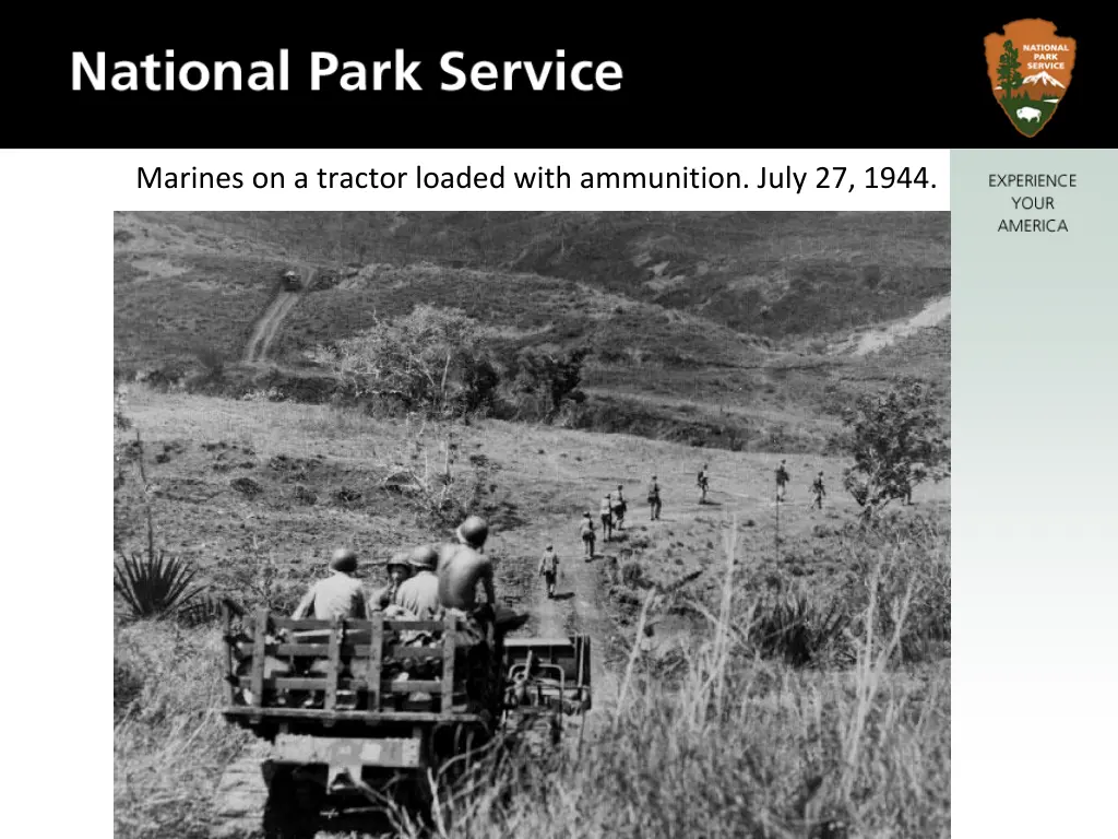 marines on a tractor loaded with ammunition july