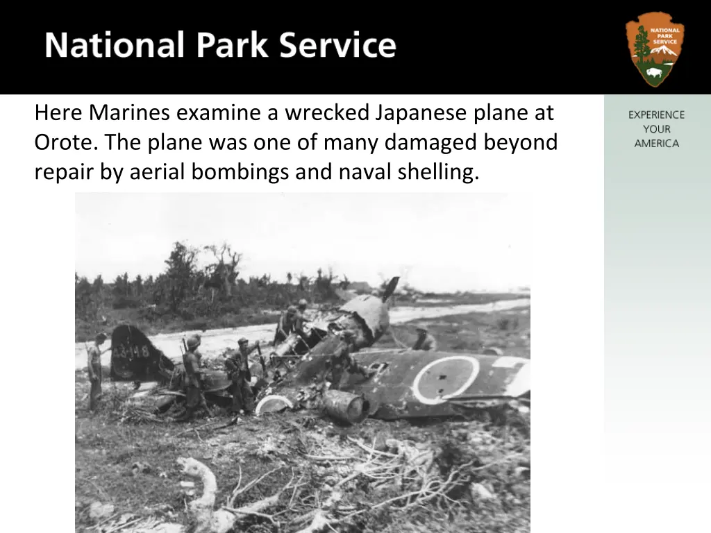 here marines examine a wrecked japanese plane