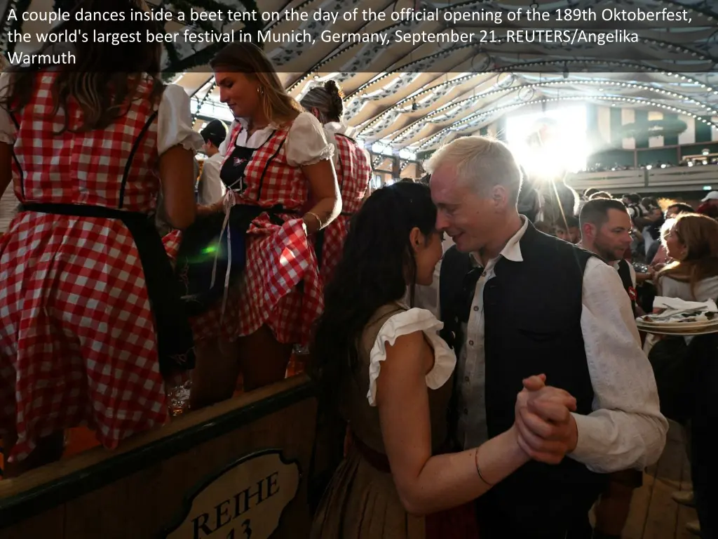 a couple dances inside a beet tent