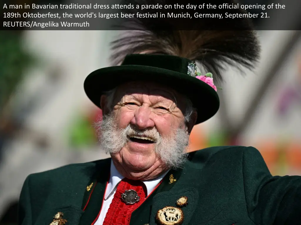 a man in bavarian traditional dress attends