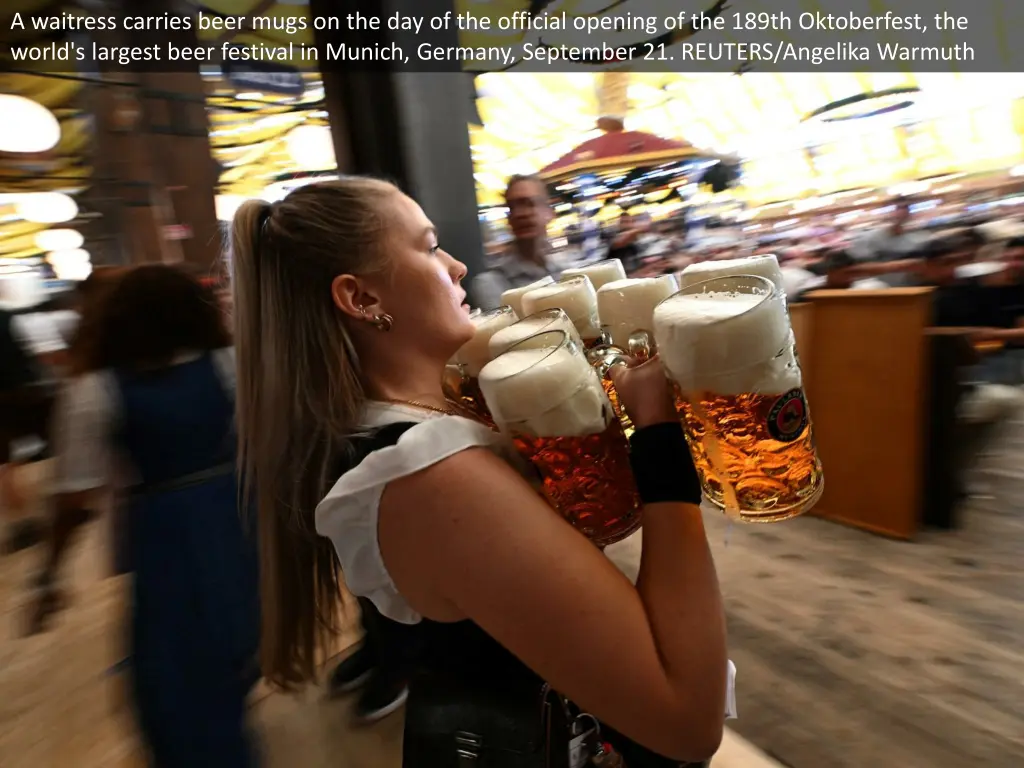 a waitress carries beer mugs 2