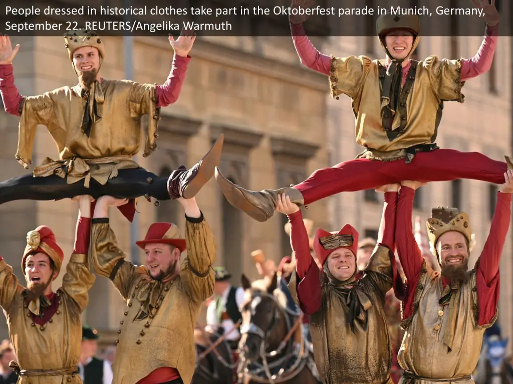 people dressed in historical clothes take part 2