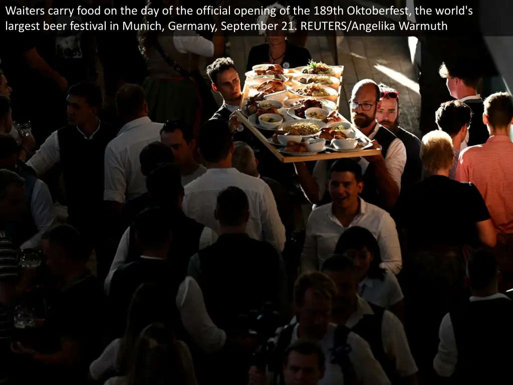 waiters carry food on the day of the official