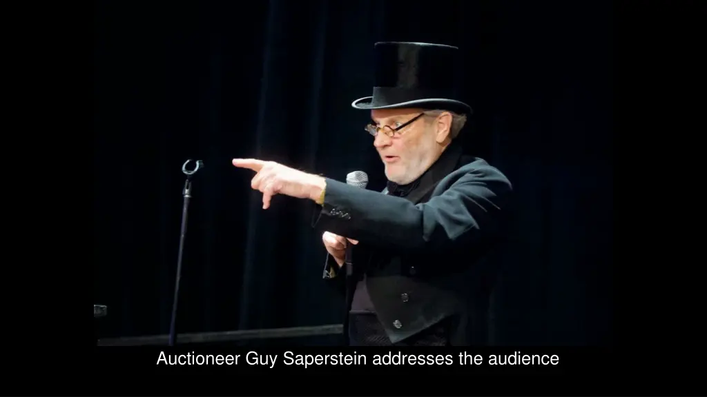 auctioneer guy saperstein addresses the audience