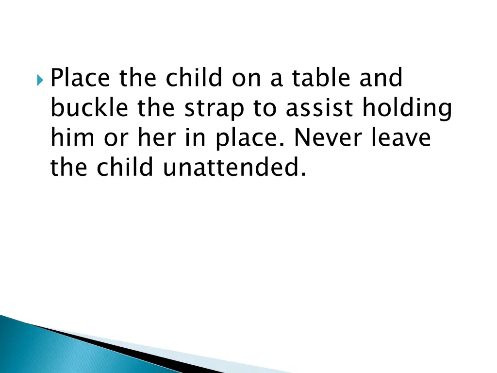 place the child on a table and buckle the strap