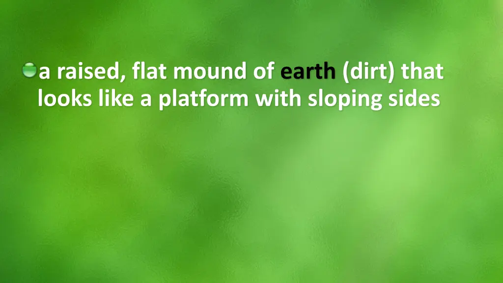 a raised flat mound of earth dirt that looks like