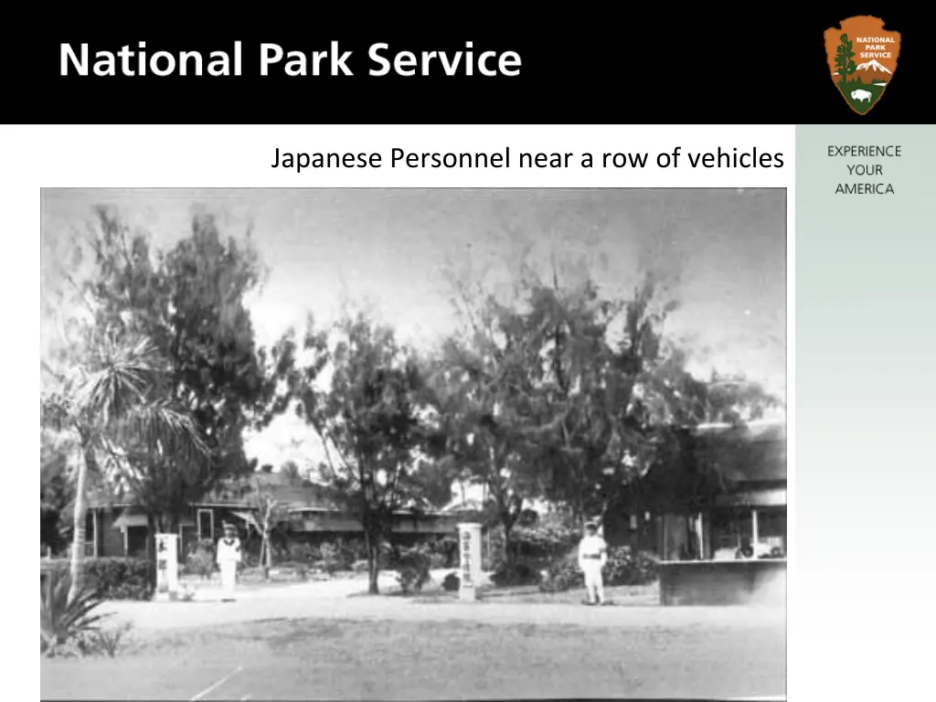 japanese personnel near a row of vehicles