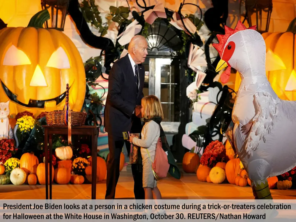 president joe biden looks at a person