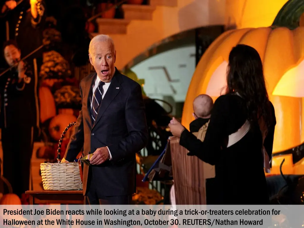 president joe biden reacts while looking