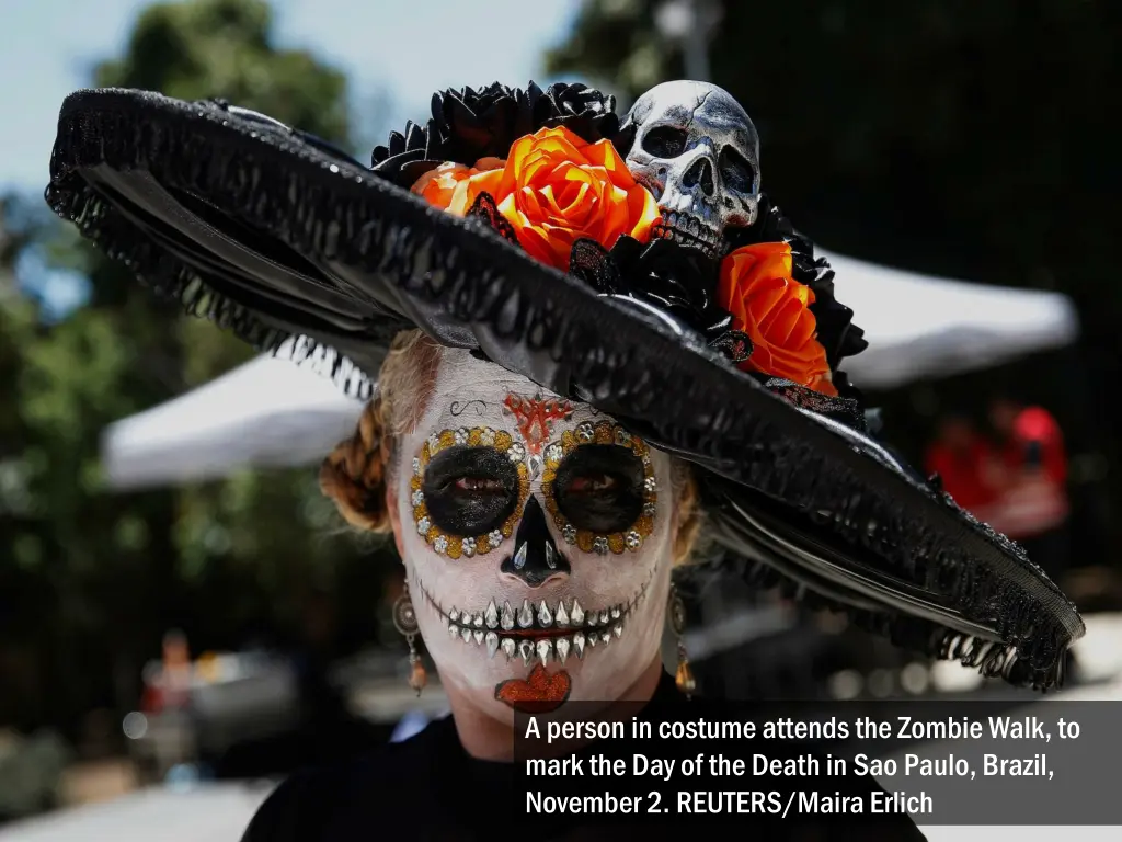 a person in costume attends the zombie walk